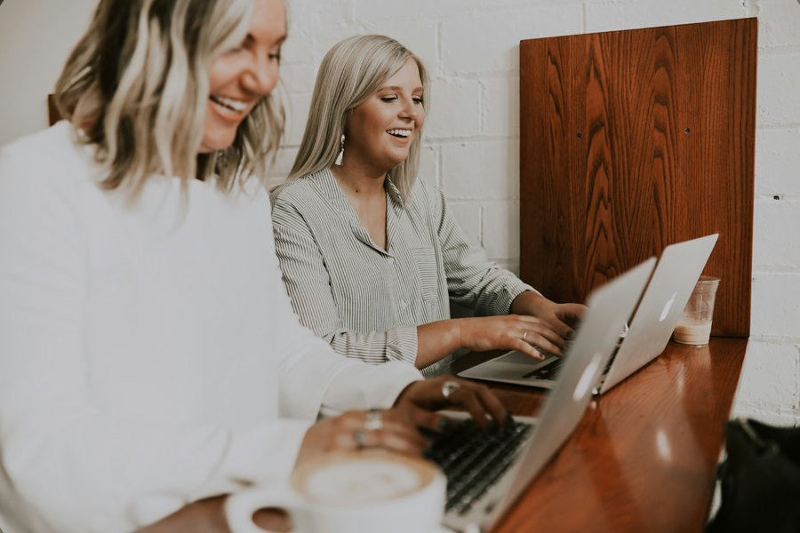 Two women working on computers