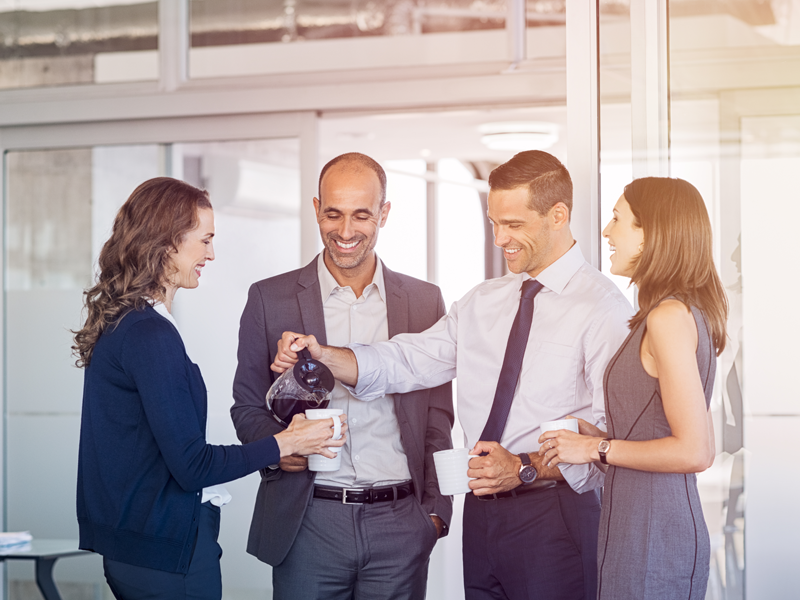 Successful franchise business owners enjoying a coffee break.