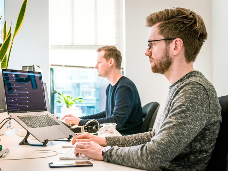 Two employees engaged in the daily operations of a turn-key business.