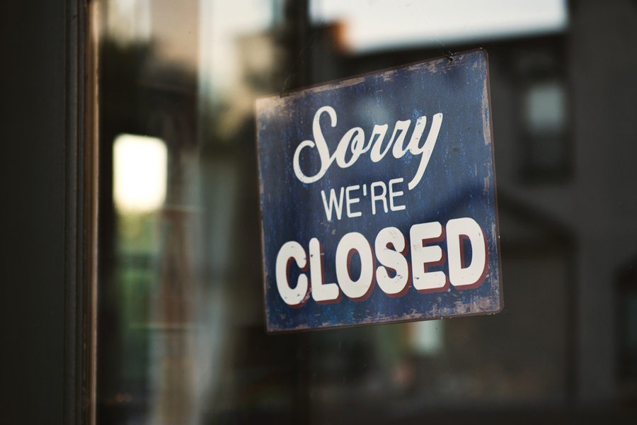 A closed sign outside a commercial cleaning franchise.